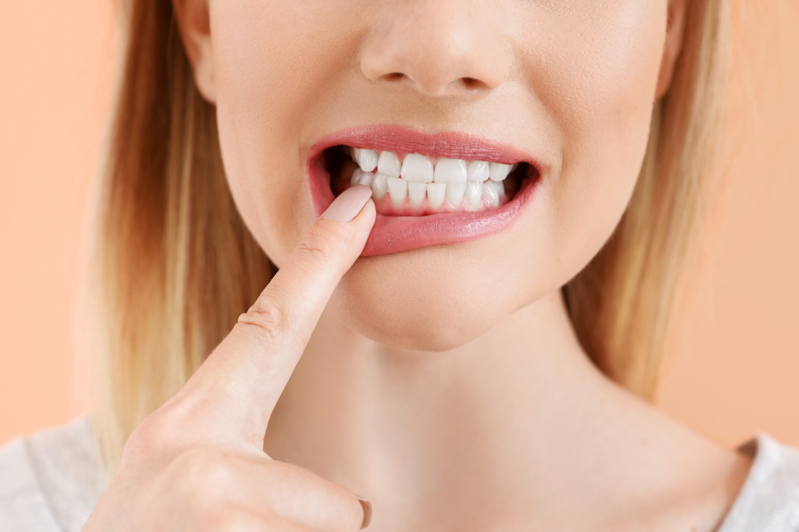 Beautiful woman with healthy teeth on color background, closeup Beautiful woman with healthy teeth on color background, closeup